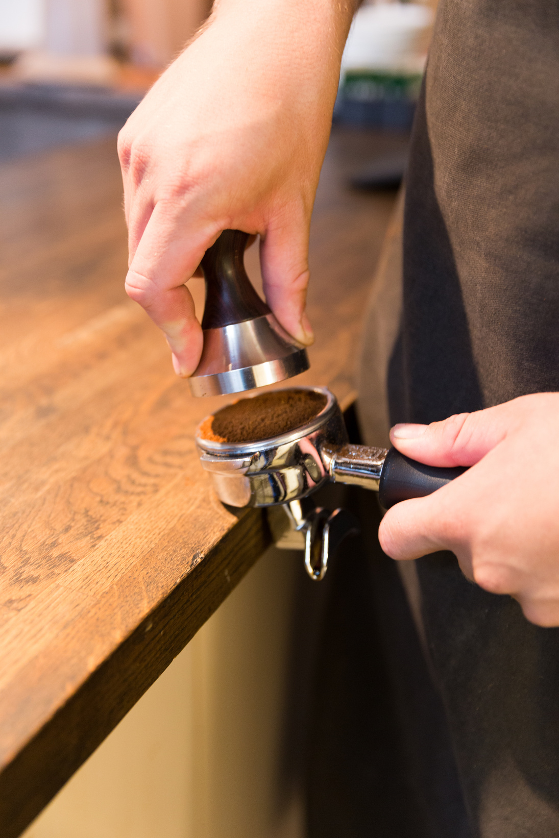 Barista stamping coffe